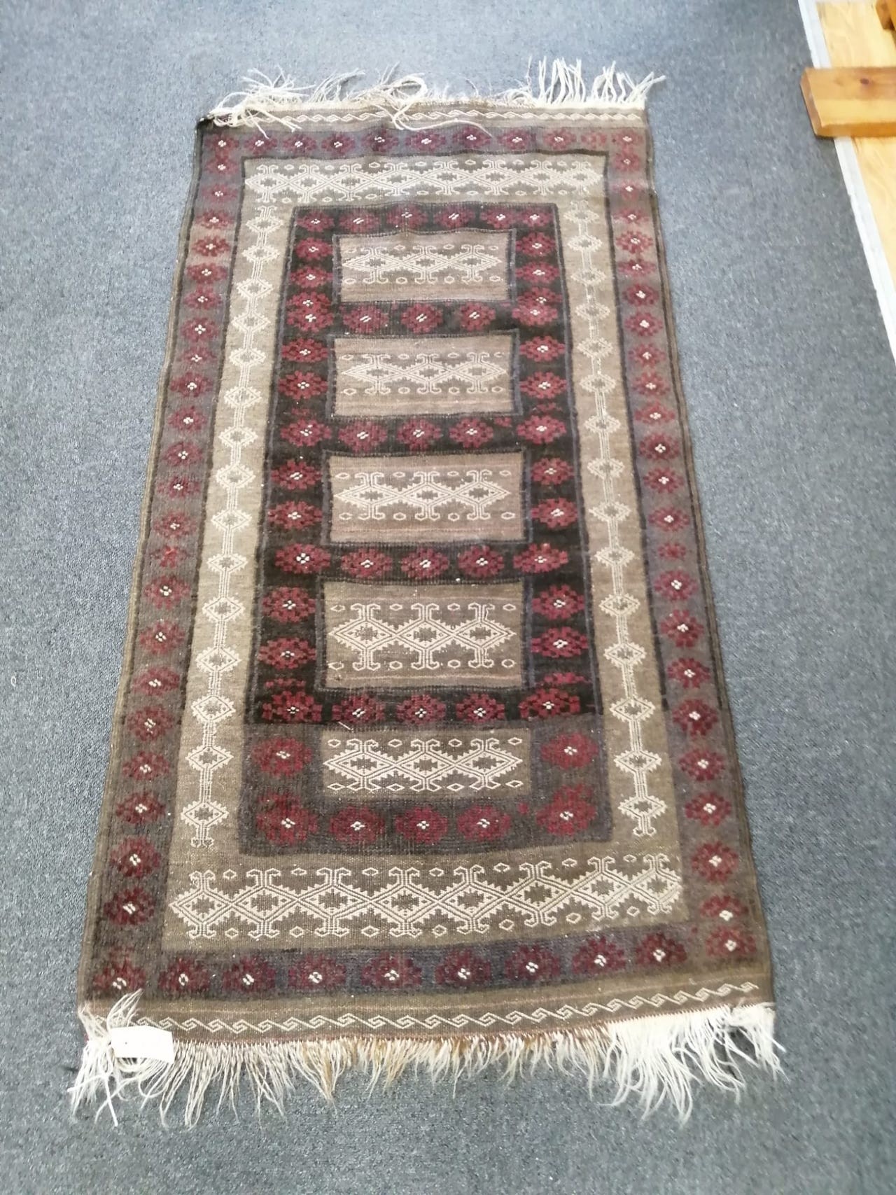 A Belouch geometric rug, 140 x 75cm